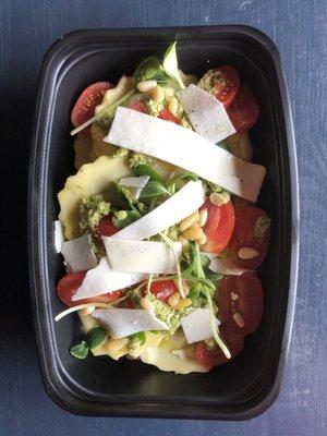 Ravioli with pesto, pine nuts, and local tomatoes.  So good.