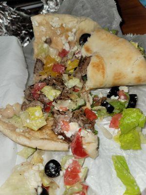 Gyro has no sauce, small chunks of cold meat