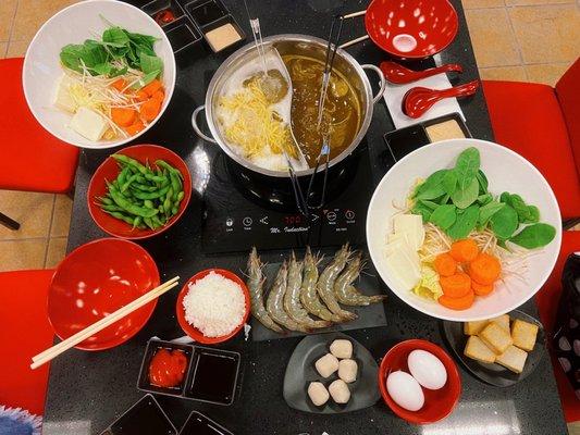 seafood course with curry and seafood broth