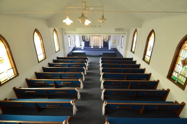 22 12-foot pews and long bridal procession aisle.