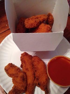 Buffalo breaded chicken fingers with a side of buffalo sauce