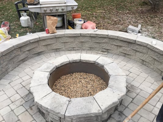 Firepit with seating wall around