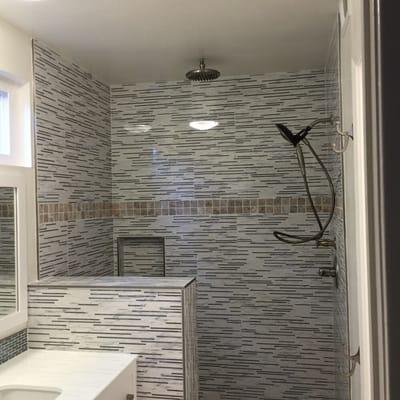 Sample of rain shower and bathroom tile installation.