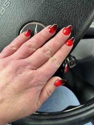 Almond shaped acrylic nails with Ferrari red and black ombré.