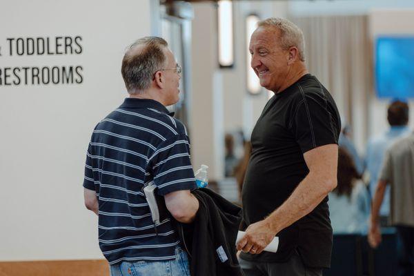 Pastor Rob McCoy talking with a congregant.