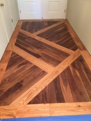 Custom walnut and oak entryway.