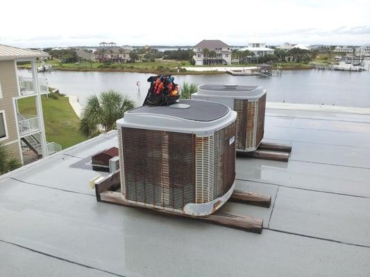 Here are the old units on the roof of a three story condo on the beach.  These units were installed after Hurricane Ivan in 2...