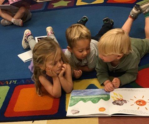 Enjoying a book on the first day of school at Gan Elohim!