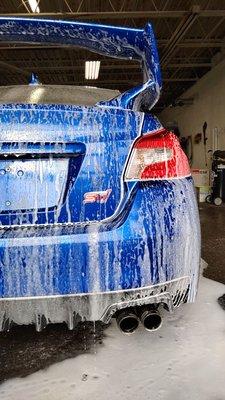 Subaru STI receiving it's Cermaic Coating prep