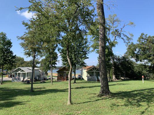 View of lake from front of cabin and some of the privately owned tiny house cabins