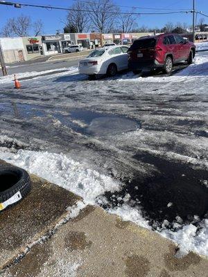 Mr. Tire Auto Service Centers 5200 Lee Hwy Arlington VA 22207 Unsafe Ice conditions in the parking lot area.