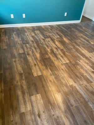 Beautiful luxury vinyl plank (LVP) flooring our expert team recently installed. LVP is great for heavy foot traffic and is 100% water-proof.