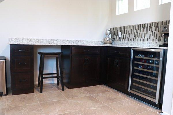 Kitchen cabinets with desk area added on to match existing cabinets