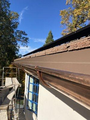 Custom step flashing retrofit to existing tile roof with copper gutter