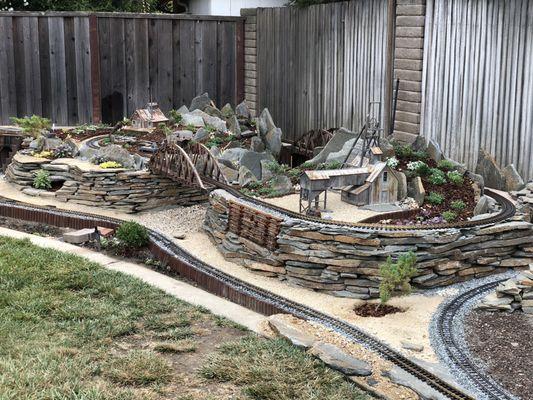 Finished garden railroad: rock, gravel, goldfines, flagstone all from u-save