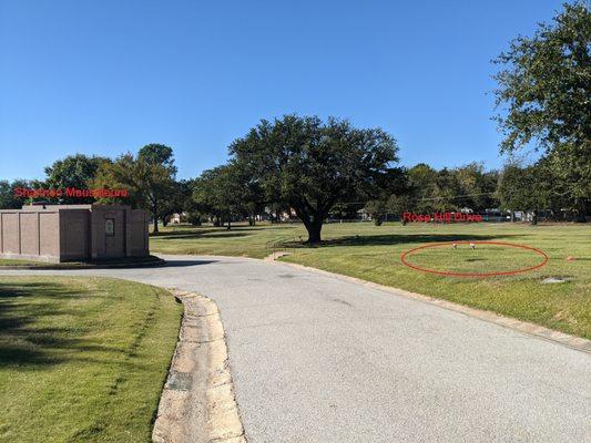 Note the red labels and circle to find the grave