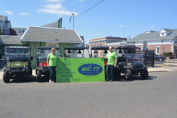 Owners Terri and Frank Young with rental carts.