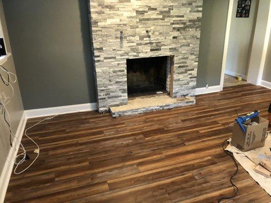 Hardwood flooring stone fireplace