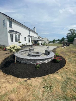 Firepit with a sitting wall and two pillars