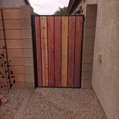 Happy customer in Santan Valley.Full restoration,using redwood lumber option.Gate repairs,fence repairs,fence installations.