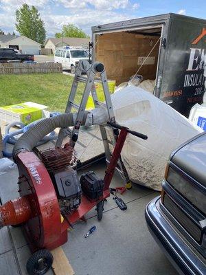 Removing mouse infested cellulose insulation from an attic with our removal machine.