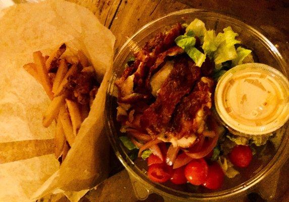 Chicken bites and fries next to my salad.