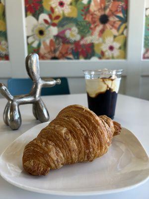 Croissant and cold brew with a soft top