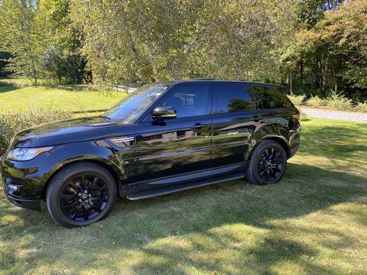 Range Rover Sport. The car is so shiny it's hard to get a accurate pic of just how awesome it looks !