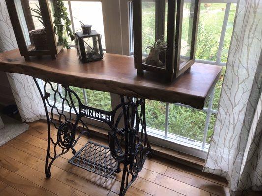 Vintage singer sewing machine base with Cherry hardwood slab as a top.