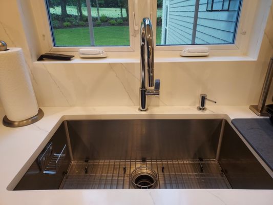 34" stainless sink with a Frank faucet.