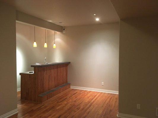 Walls and ceiling after painting over red walls, faux finish accent wall and faux finish ceiling.