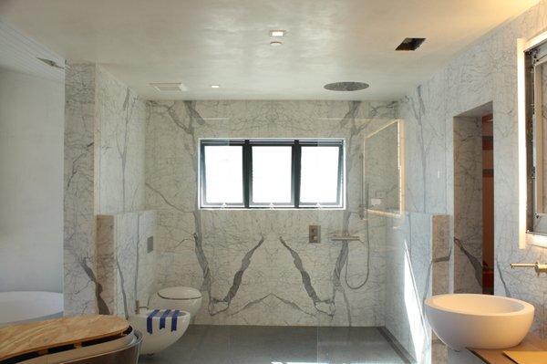 Progress Pic! Master bathroom wrapped in slabs of marble. Private residence in Lido Isle, Newport Beach.