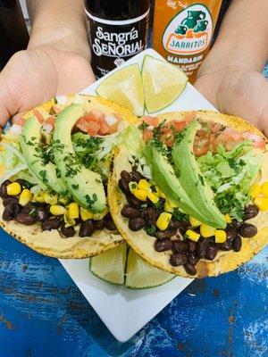 Vegan tostadas  Gluten free tostadas , humans spread black beans corn lettuce pico and avocado