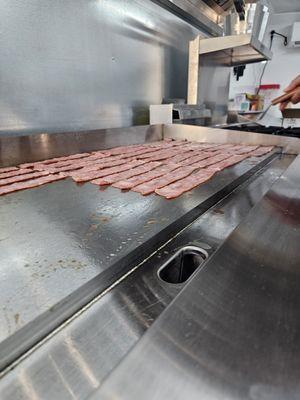 Turkey Bacon getting cooked.