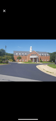 A large driveway that we paved with new asphalt.