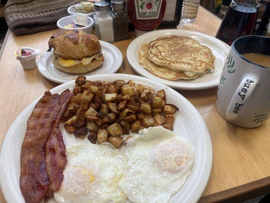 Breakfast platter and a sausage and egg croissant