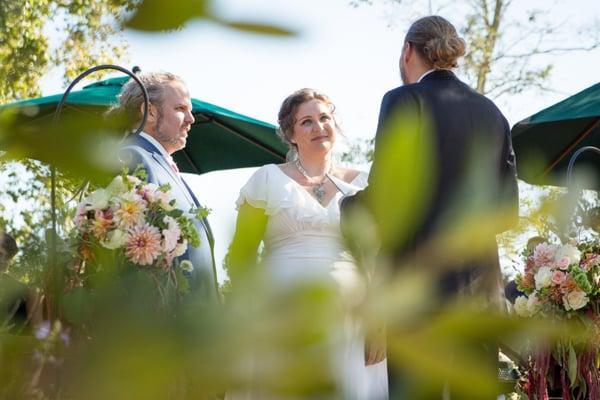 Groom, Bride and Pastor.