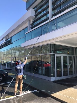 Water fed pole window cleaning. Keeps our feet on the ground. The pure water dries streak free!