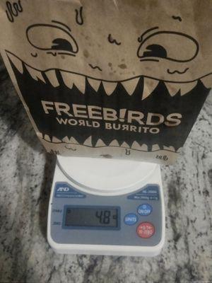 Weight of the chips freebirds give me . Less than 5oz with paper bag