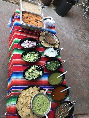 Rice and beans onions cucumbers, limes cilantro salsa Fresca green and red salsa Guacamole chips and salsa relish and sour cream