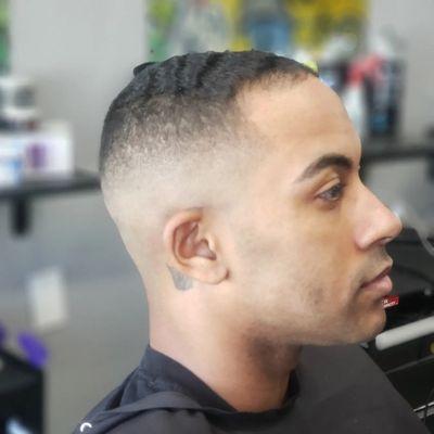 Mid to high skin fade on waves. Eyebrows. Crispy razor line up on everything