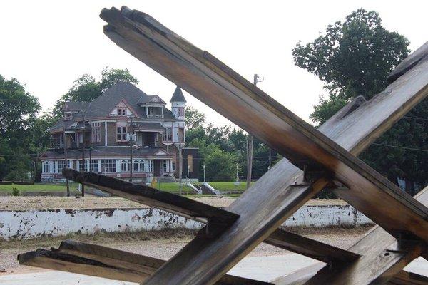 Exploring Shreveport. Art created using reclaimed timber from Austen Place. The mansion in the background.