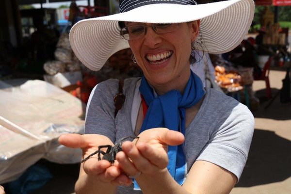 Cambodia 2018: Stopped for a light snack of fried tarantulas at the market before treating patients.