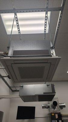 Ceiling mounted ac unit looks like a big grill