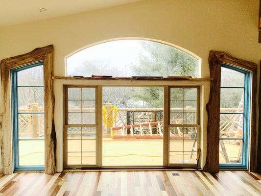 arched windows trimmed and finished plus 7 species hardwood floor