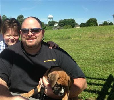 Sal Pizzurro (Owner) with Son, Max, and Boxer pup.