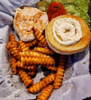 Fried chicken sandwich with garlic and onion crinkle fries