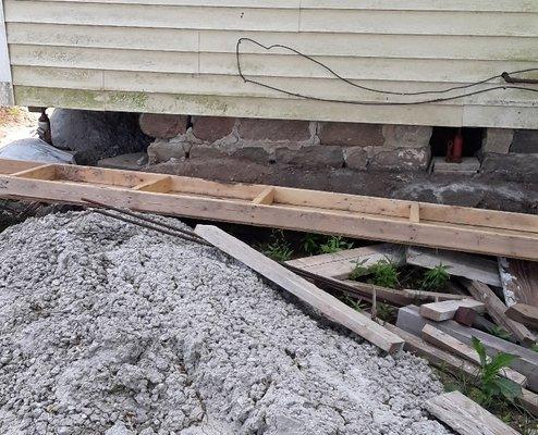 Huge pile of mixed and cured concrete wasted in our yard