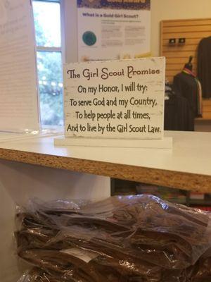 A sign inside the store with the Girl Scout promise.