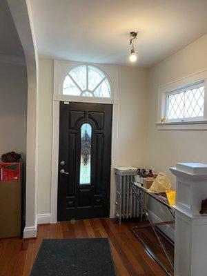 Entryway after! Notice they also painted our radiators!